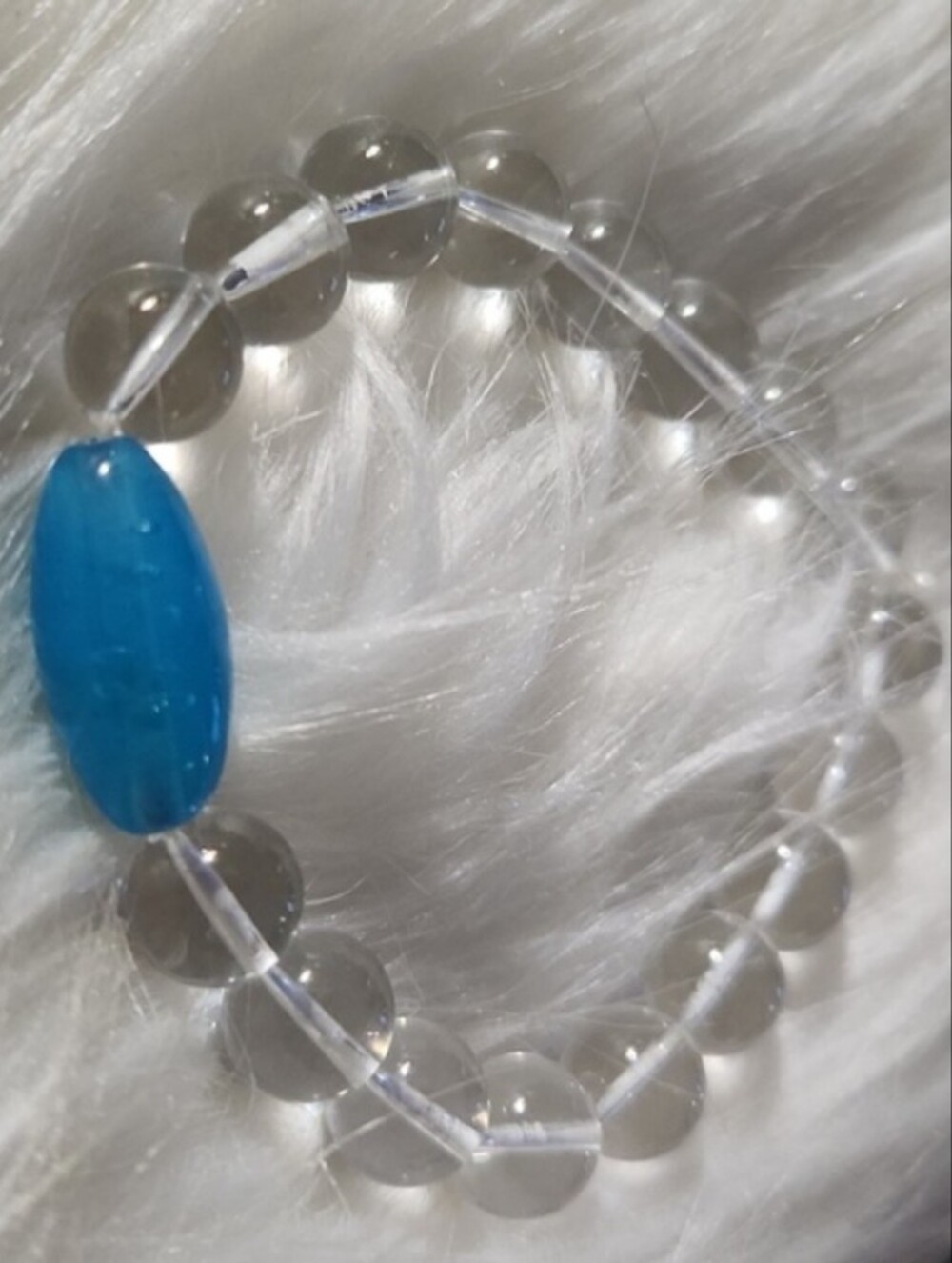 Clear Beaded Stretch Bracelet with Blue Accent Bead